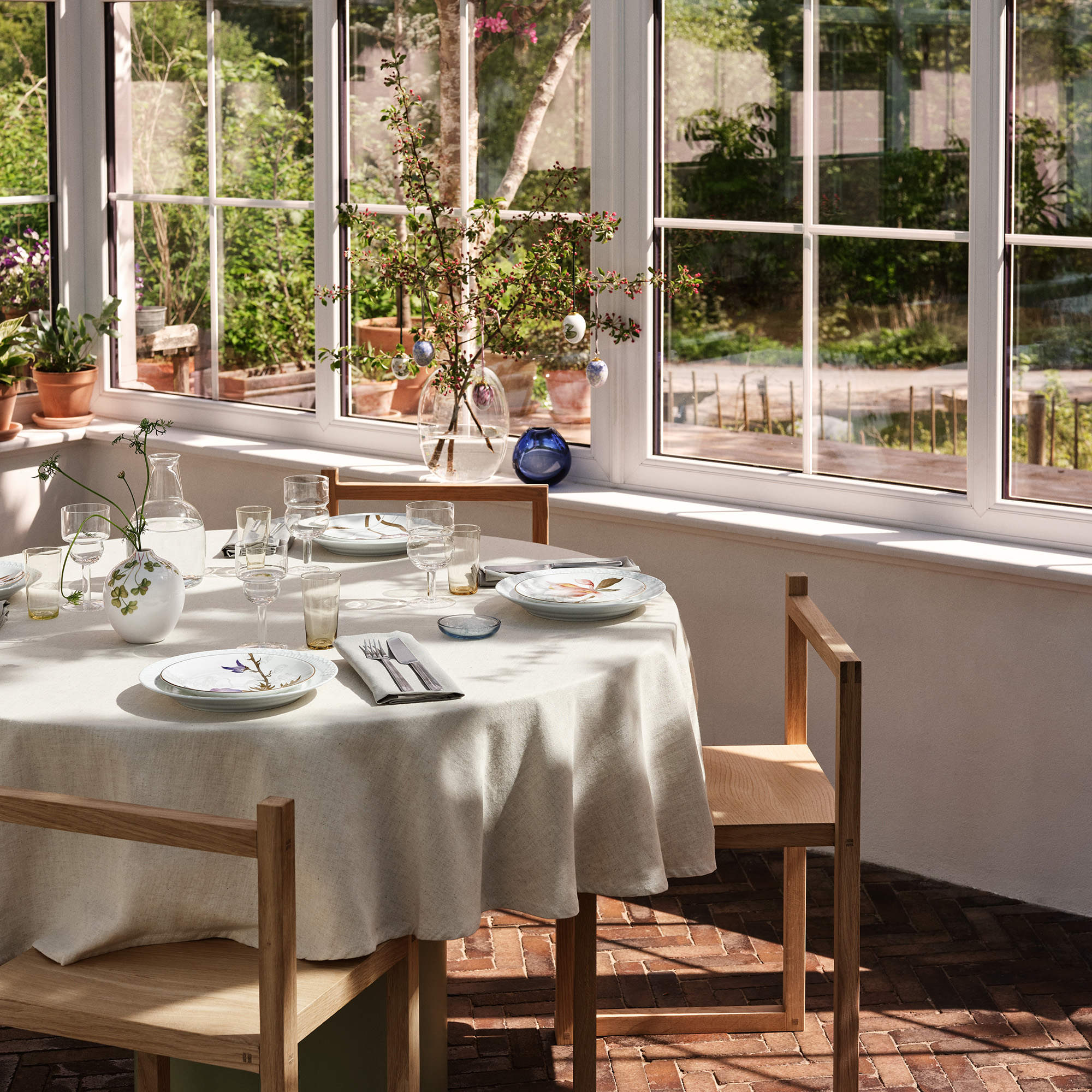 A blooming table set with Flora and Easter eggs from Royal Copenhagen